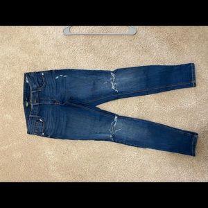 Two holes at knee area.